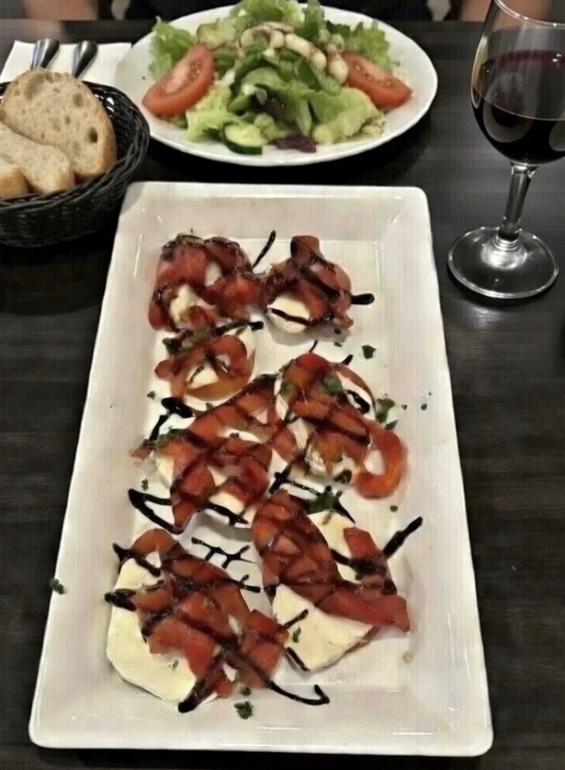 Fresh mozzarella and tomatoes finished with balsamic glaze